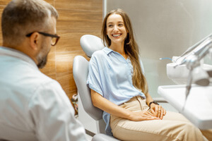 dentist talking with female patient
